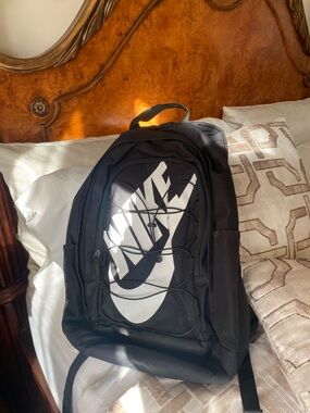 Nike Black Backpack with White Swoosh and Bungee Cord